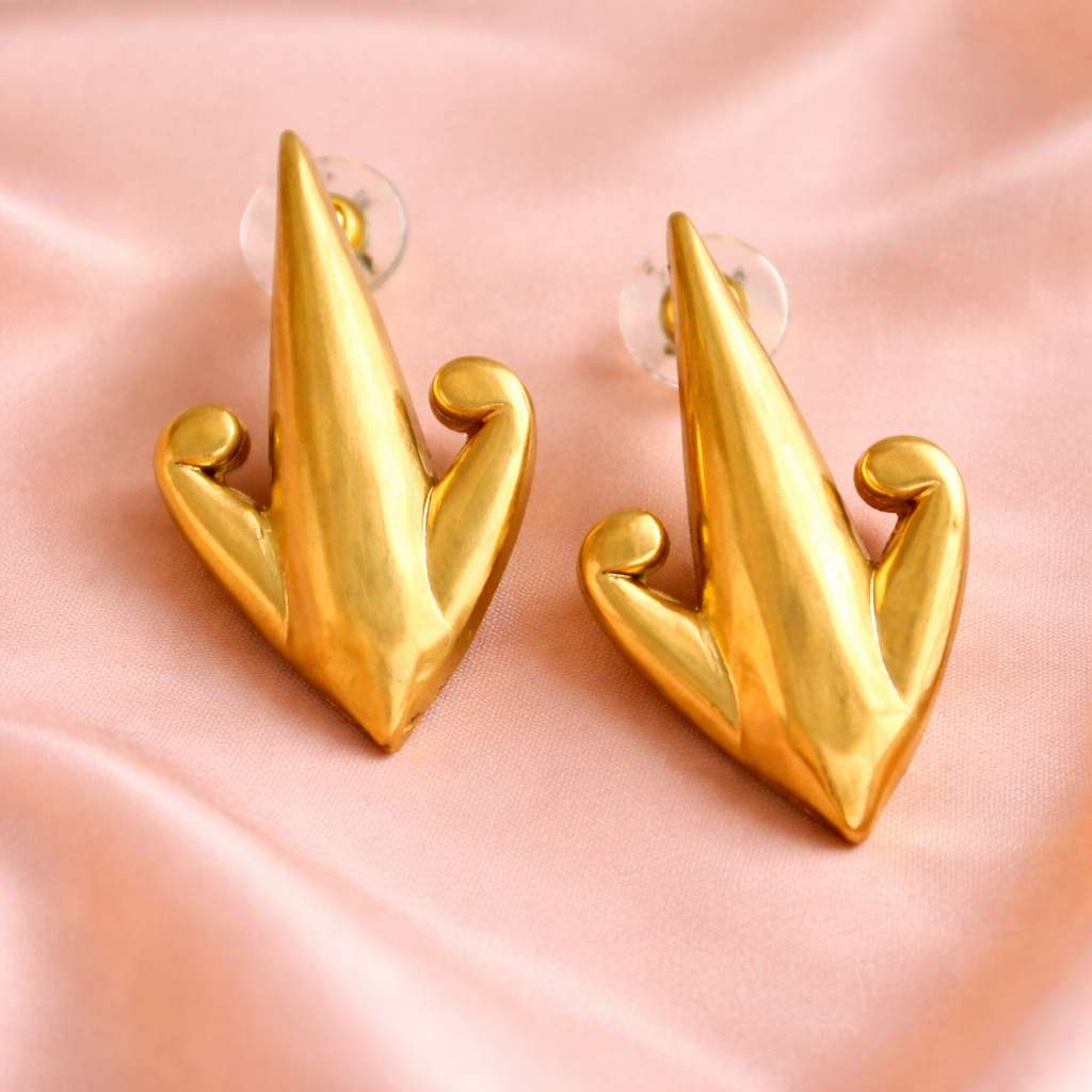 The trishul stud ( Trident , symbol of power and balance)