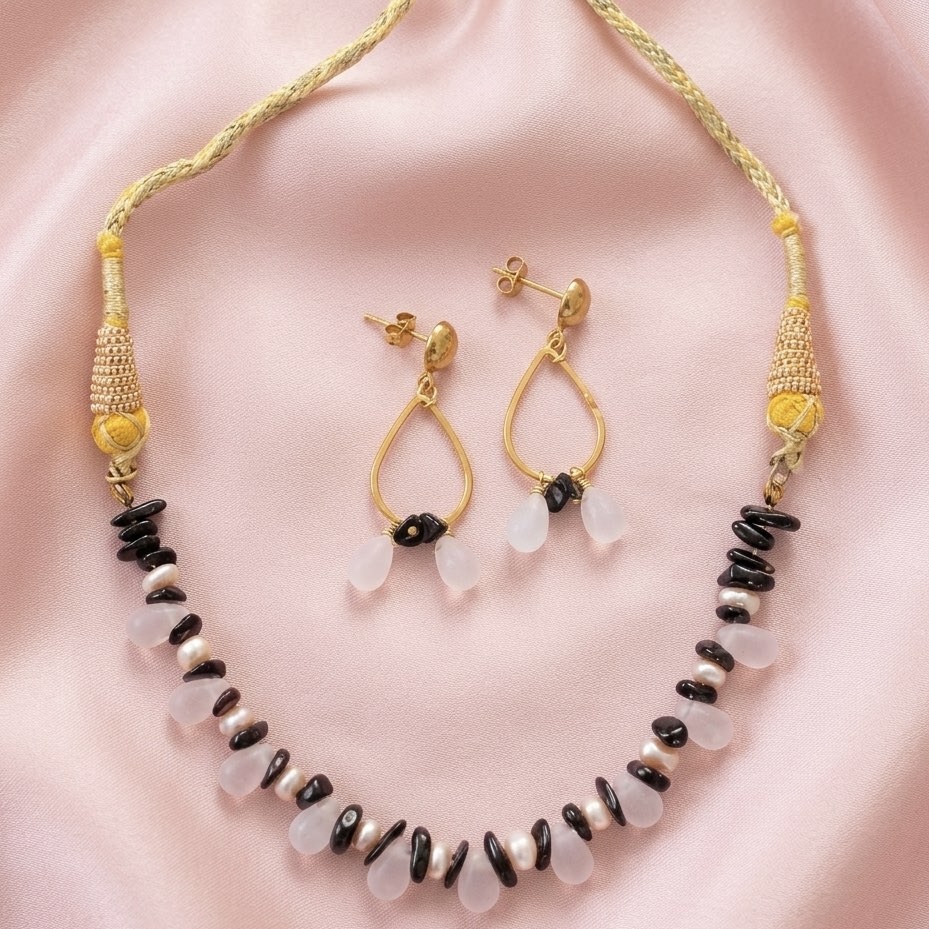 Fresh water pearls with garnet and crystals