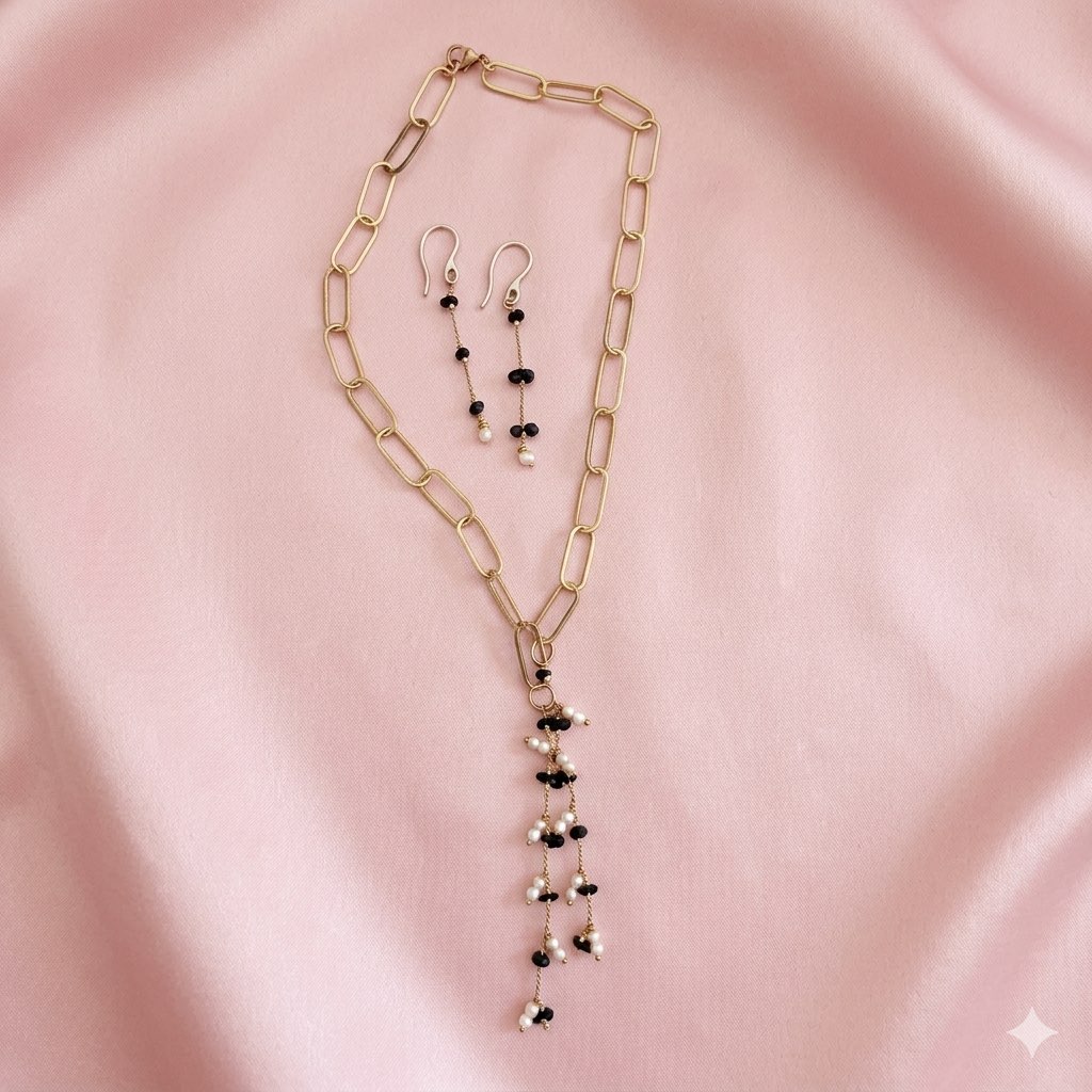 A pearl set with black stone and fresh water pearls